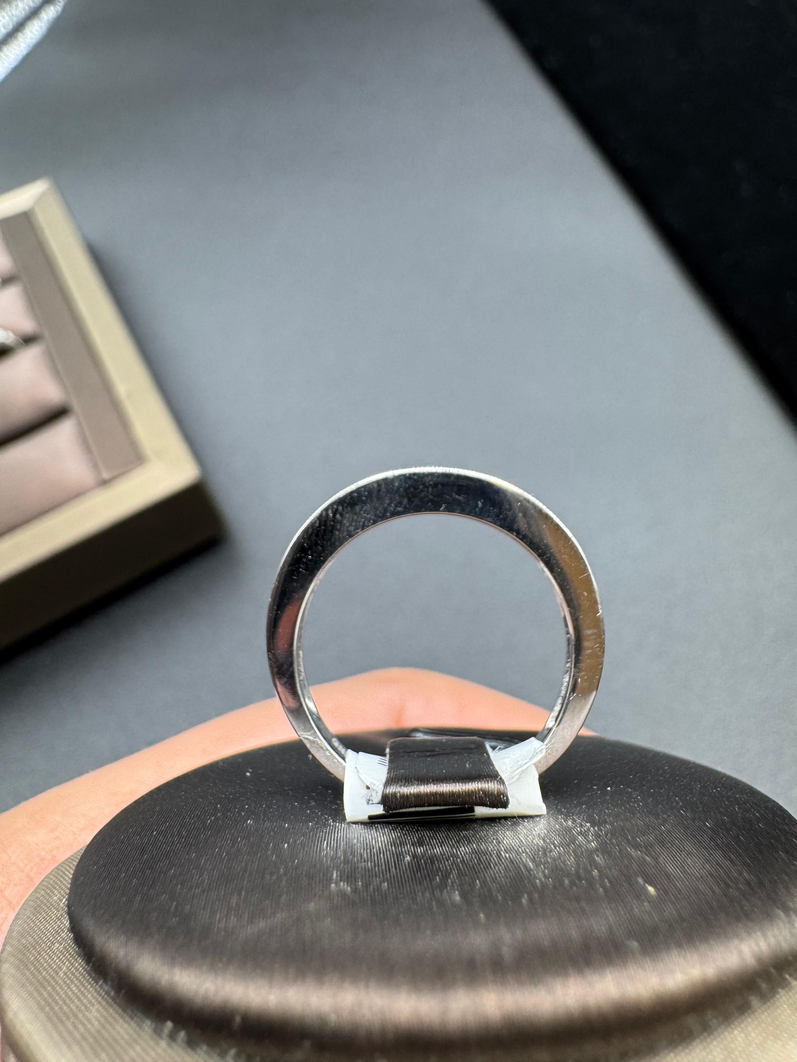 14KT White Gold 0.25CT Diamond Band.